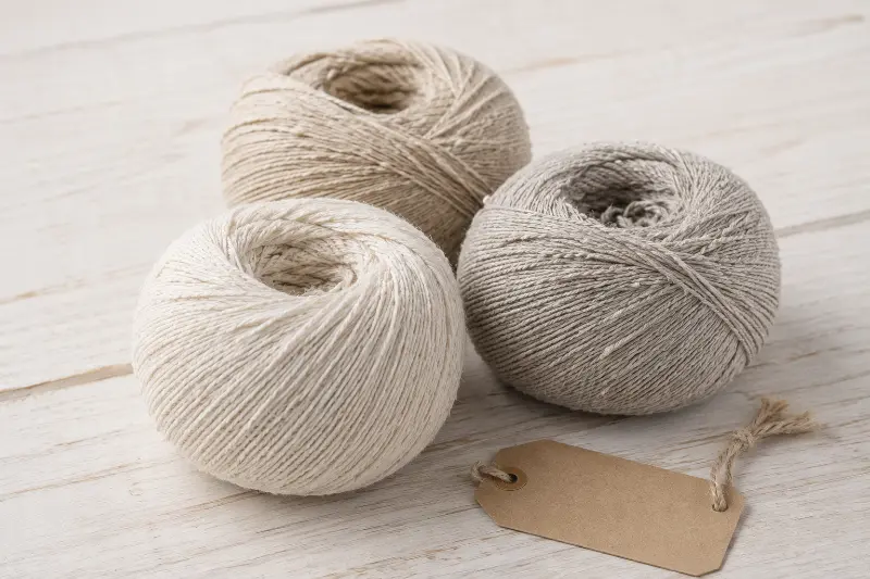 Linknit slub linen yarn material close-up showing irregular slub texture yarn balls