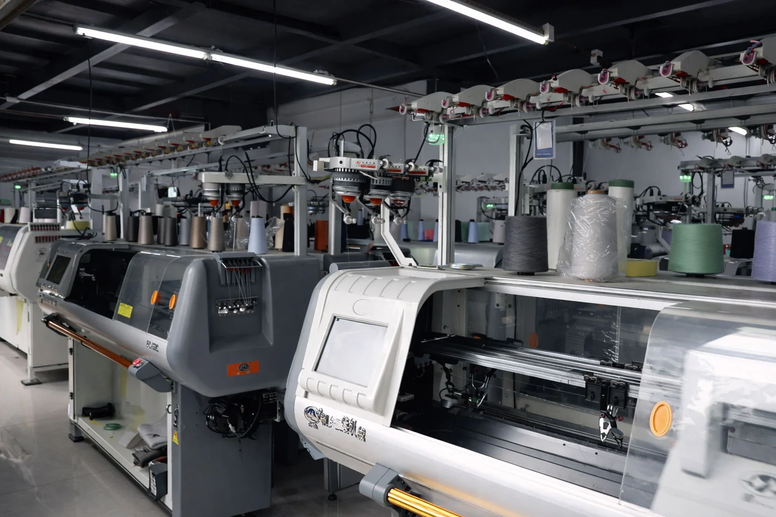 Linknit flat-knitting machine workshop — bulk sweater production