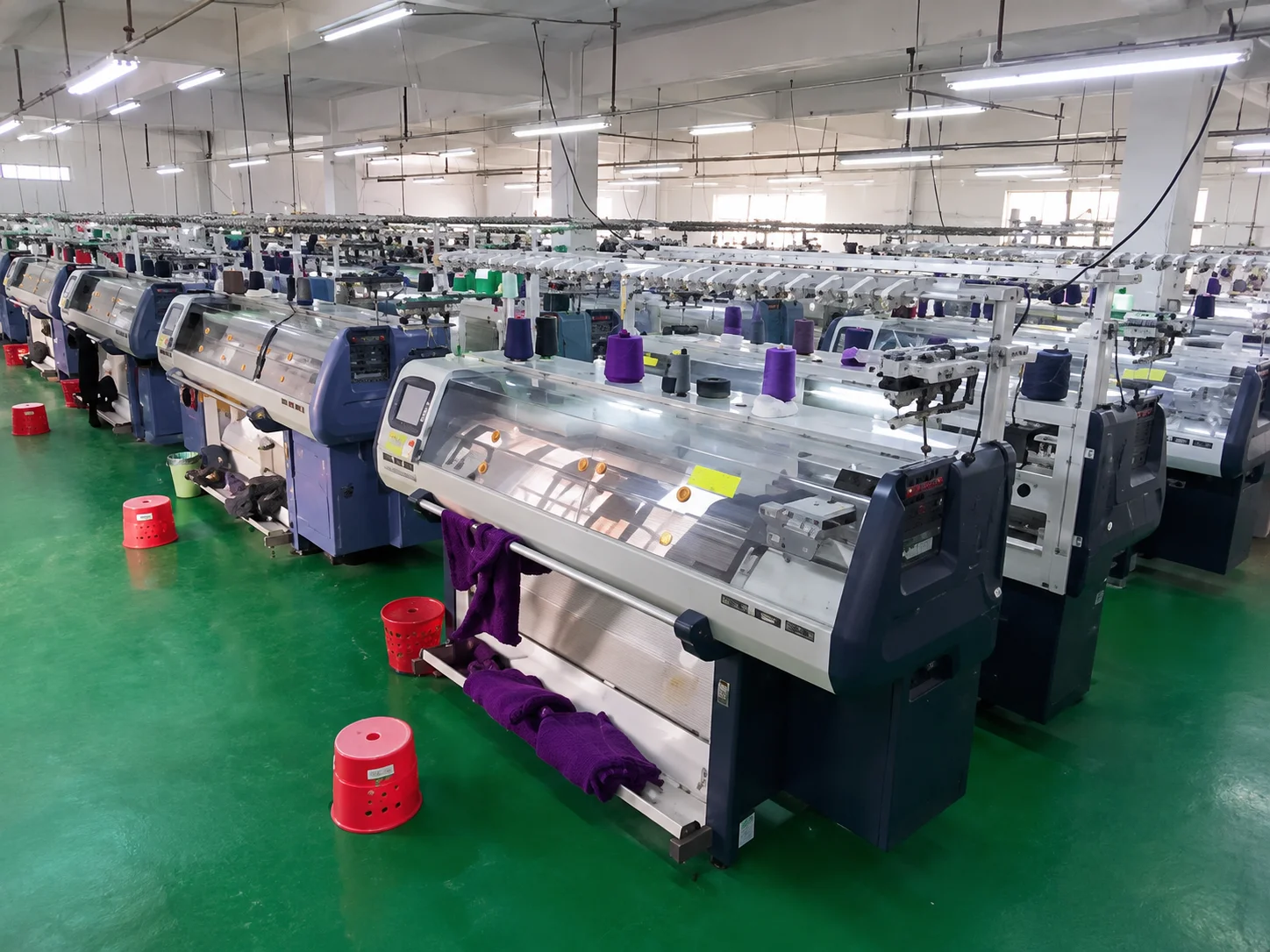 Linknit computerized flat knitting machine cluster