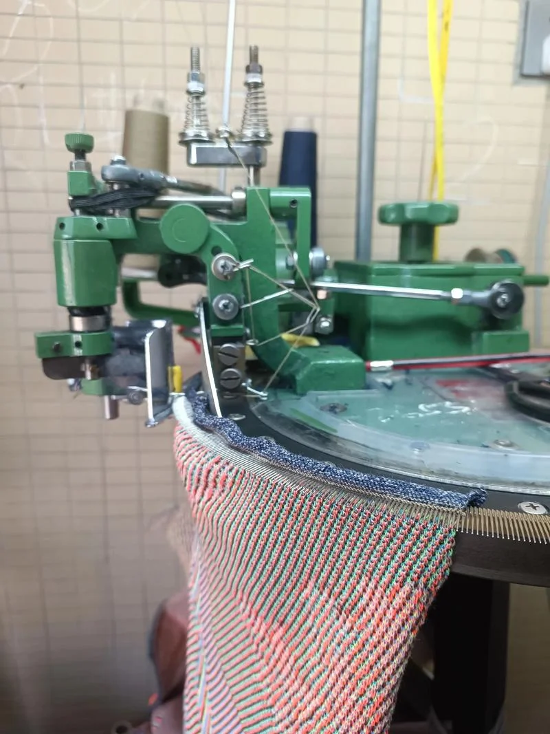 Linknit skilled worker operating dial linking machine