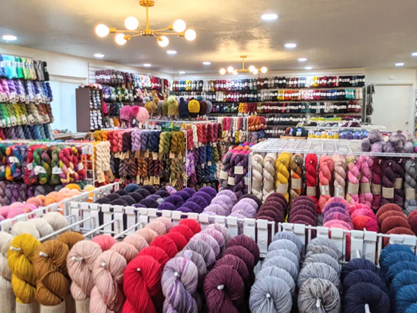 Linknit yarn sample room: assorted yarn types and color palette display